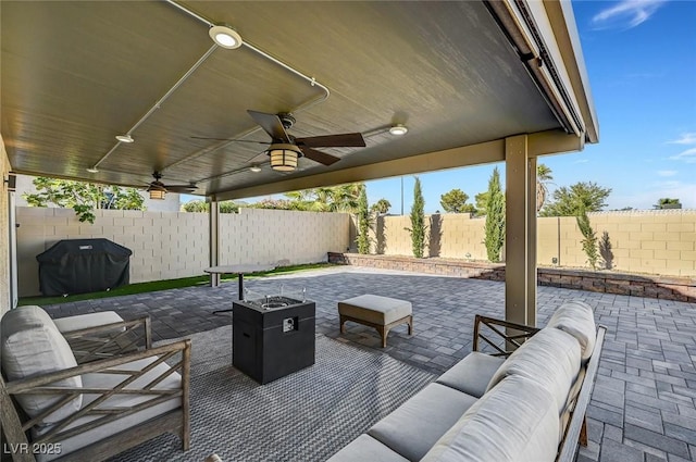 8316 Maplestar Rd, Las Vegas, NV 89128 - fenced backyard with a ceiling fan, outdoor lounge area, a patio area, and a grill