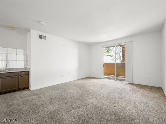 231 W Horizon Ridge Parkway Unit 212, Henderson, NV 89012 - unfurnished room with a sink, light colored carpet, and baseboards