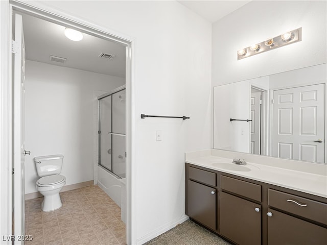 231 W Horizon Ridge Parkway Unit 212, Henderson, NV 89012 - full bathroom with vanity, toilet, baseboards, and bath / shower combo with glass door