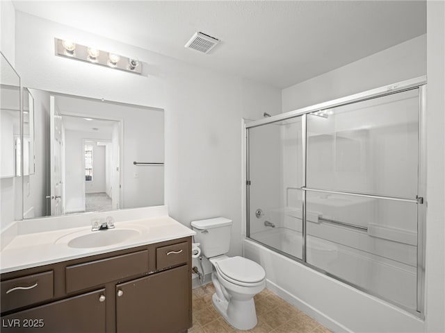 231 W Horizon Ridge Parkway Unit 212, Henderson, NV 89012 - bathroom featuring vanity, toilet, and combined bath / shower with glass door