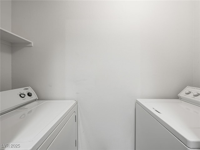 231 W Horizon Ridge Parkway Unit 212, Henderson, NV 89012 - washroom with washing machine and dryer