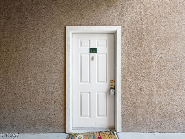 231 W Horizon Ridge Parkway Unit 212, Henderson, NV 89012 - doorway to property featuring stucco siding