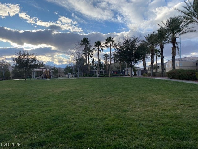 6316 Beige Bluff St Unit 201, North Las Vegas, NV 89081 - surrounding community featuring a lawn