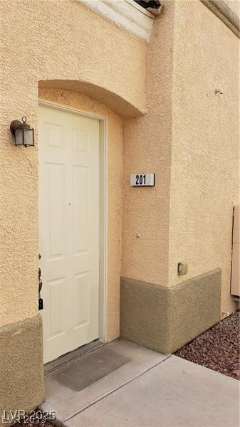 6316 Beige Bluff St Unit 201, North Las Vegas, NV 89081 - property entrance with stucco siding