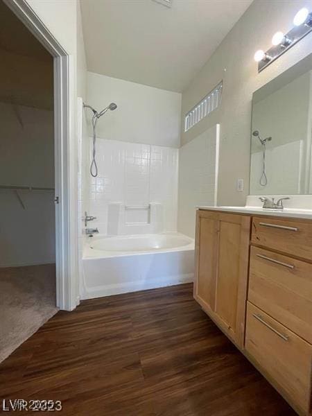 6316 Beige Bluff St Unit 201, North Las Vegas, NV 89081 - bathroom featuring shower / tub combination, vanity, wood finished floors, and a walk in closet