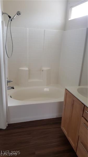 6316 Beige Bluff St Unit 201, North Las Vegas, NV 89081 - full bathroom with vanity, wood finished floors, and bathtub / shower combination