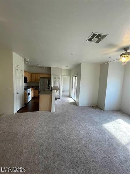 6316 Beige Bluff St Unit 201, North Las Vegas, NV 89081 - kitchen featuring open floor plan, refrigerator, white range with electric stovetop, ceiling fan, and dark colored carpet