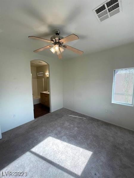 6316 Beige Bluff St Unit 201, North Las Vegas, NV 89081 - carpeted empty room featuring arched walkways and a ceiling fan