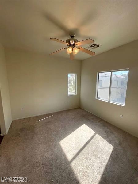 6316 Beige Bluff St Unit 201, North Las Vegas, NV 89081 - spare room featuring carpet flooring and ceiling fan