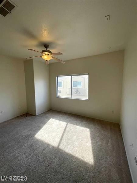 6316 Beige Bluff St Unit 201, North Las Vegas, NV 89081 - empty room featuring light carpet and a ceiling fan