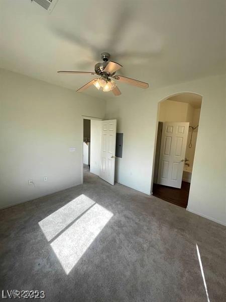 6316 Beige Bluff St Unit 201, North Las Vegas, NV 89081 - unfurnished bedroom with arched walkways, carpet floors, and a ceiling fan
