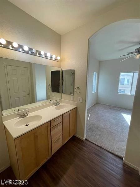 6316 Beige Bluff St Unit 201, North Las Vegas, NV 89081 - bathroom with a ceiling fan, double vanity, wood finished floors, and baseboards