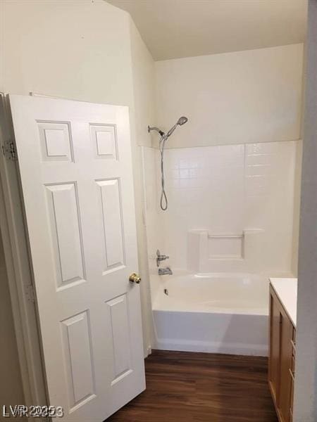 6316 Beige Bluff St Unit 201, North Las Vegas, NV 89081 - full bathroom with wood finished floors, vanity, and washtub / shower combination