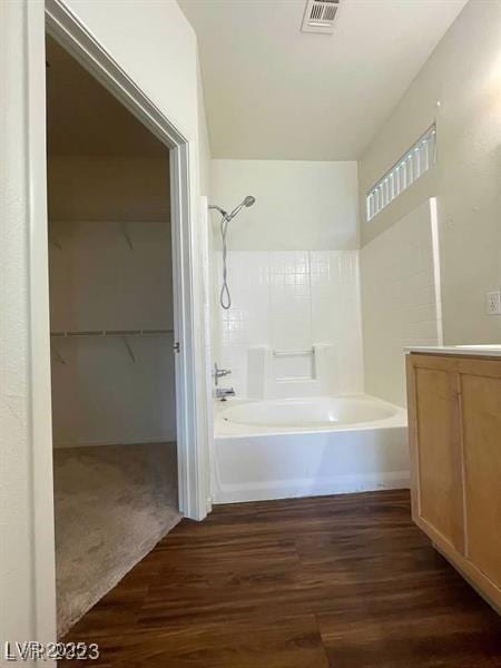 6316 Beige Bluff St Unit 201, North Las Vegas, NV 89081 - full bath with wood finished floors, tub / shower combination, vanity, and a walk in closet