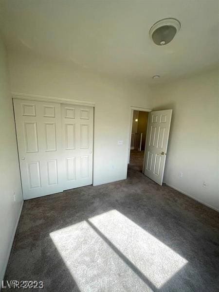 6316 Beige Bluff St Unit 201, North Las Vegas, NV 89081 - unfurnished bedroom featuring carpet and a closet