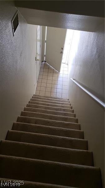 6316 Beige Bluff St Unit 201, North Las Vegas, NV 89081 - stairs with tile patterned floors