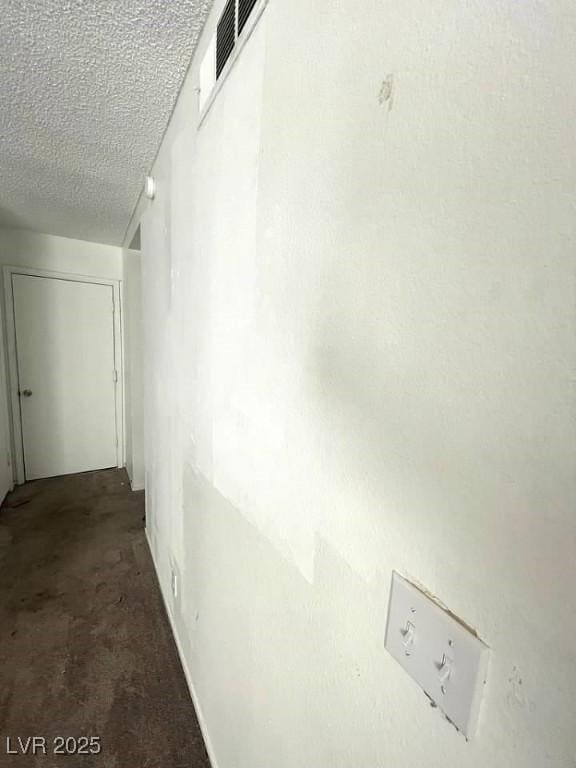 4363 Spencer St Unit 8, Las Vegas, NV 89119 - hall with carpet floors and a textured ceiling