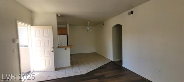 75 N Valle Verde Dr Unit 2121, Henderson, NV 89074 - empty room with arched walkways and wood finished floors