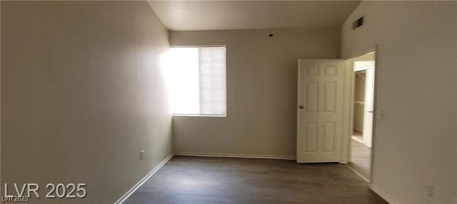 75 N Valle Verde Dr Unit 2121, Henderson, NV 89074 - spare room with dark wood-type flooring and baseboards