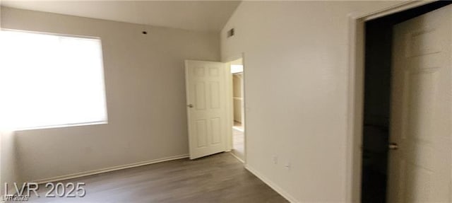 75 N Valle Verde Dr Unit 2121, Henderson, NV 89074 - unfurnished bedroom with multiple windows, wood finished floors, and baseboards