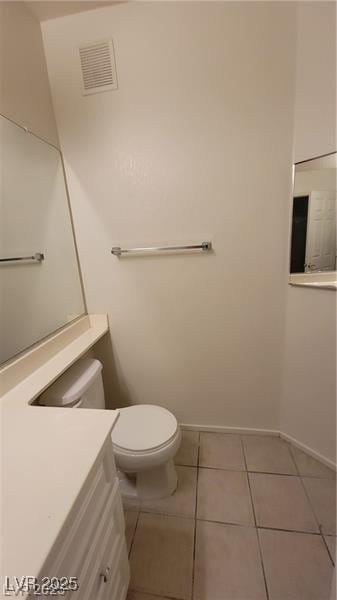 75 N Valle Verde Dr Unit 2121, Henderson, NV 89074 - half bath featuring vanity, toilet, tile patterned floors, and baseboards