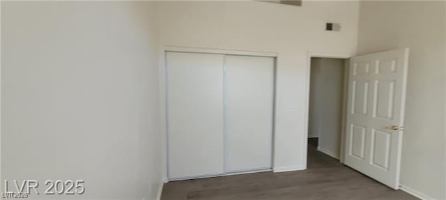 75 N Valle Verde Dr Unit 2121, Henderson, NV 89074 - unfurnished bedroom with baseboards, a closet, and wood finished floors