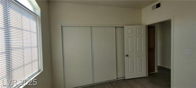 75 N Valle Verde Dr Unit 2121, Henderson, NV 89074 - unfurnished bedroom featuring a closet and dark wood-style floors