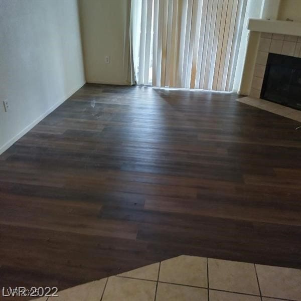 75 N Valle Verde Dr Unit 2121, Henderson, NV 89074 - unfurnished living room featuring wood finished floors and a fireplace
