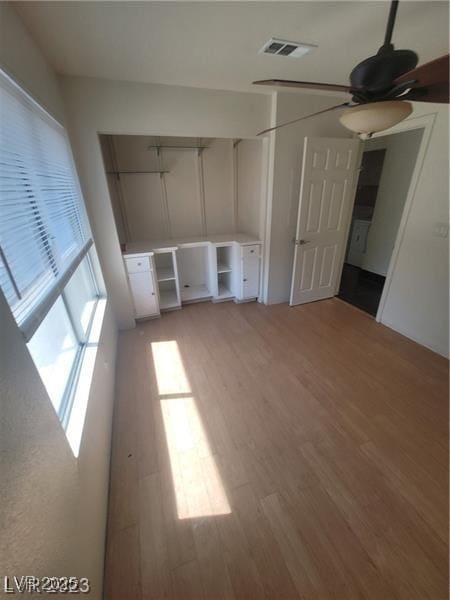 2761 Lodestone Dr Unit 63, Las Vegas, NV 89117 - empty room with light wood-style flooring and ceiling fan