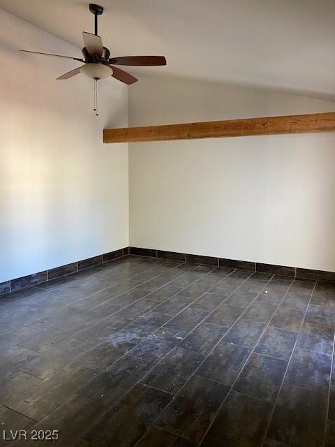 2761 Lodestone Dr Unit 63, Las Vegas, NV 89117 - spare room with vaulted ceiling, dark wood-style flooring, ceiling fan, and baseboards