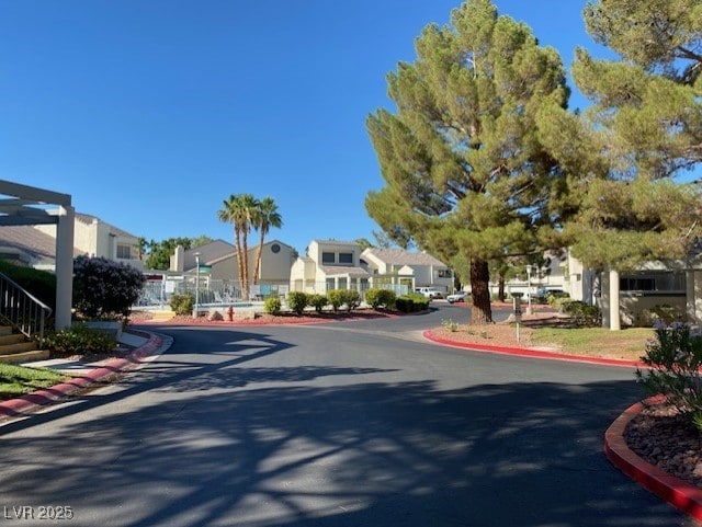2761 Lodestone Dr Unit 63, Las Vegas, NV 89117 - view of asphalt street with a residential view and curbs