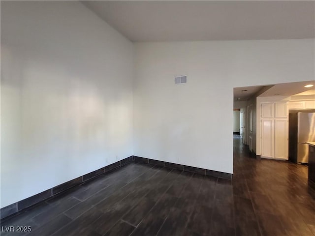 2761 Lodestone Dr Unit 63, Las Vegas, NV 89117 - empty room with dark wood-style floors and baseboards