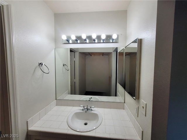 2761 Lodestone Dr Unit 63, Las Vegas, NV 89117 - bathroom featuring vanity and a textured wall
