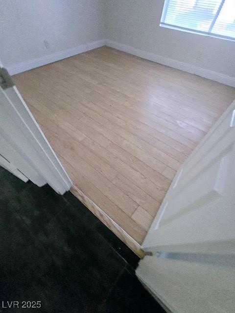 2761 Lodestone Dr Unit 63, Las Vegas, NV 89117 - spare room with wood finished floors and baseboards