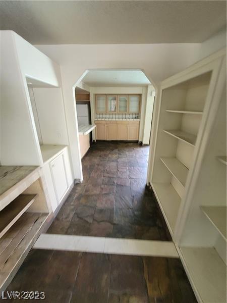 3797 Monument St, Las Vegas, NV 89121 - corridor featuring arched walkways and built in shelves