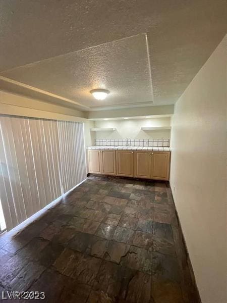 3797 Monument St, Las Vegas, NV 89121 - unfurnished room with a textured ceiling and baseboards