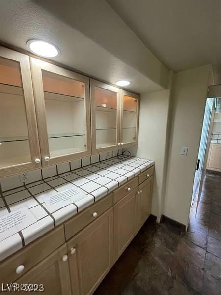 3797 Monument St, Las Vegas, NV 89121 - kitchen with tile countertops and glass insert cabinets