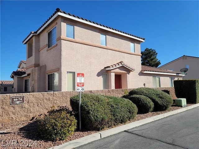 70 Belle Essence Ave, Las Vegas, NV 89123 - view of front of property featuring a tile roof and stucco siding