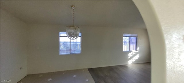 1301 Madison Ave, Las Vegas, NV 89106 - unfurnished dining area featuring a chandelier and wood finished floors