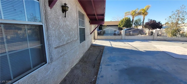 1301 Madison Ave, Las Vegas, NV 89106 - view of side of home featuring stucco siding and a gate