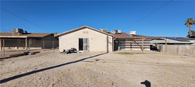 1301 Madison Ave, Las Vegas, NV 89106 - back of property with central air condition unit and stucco siding