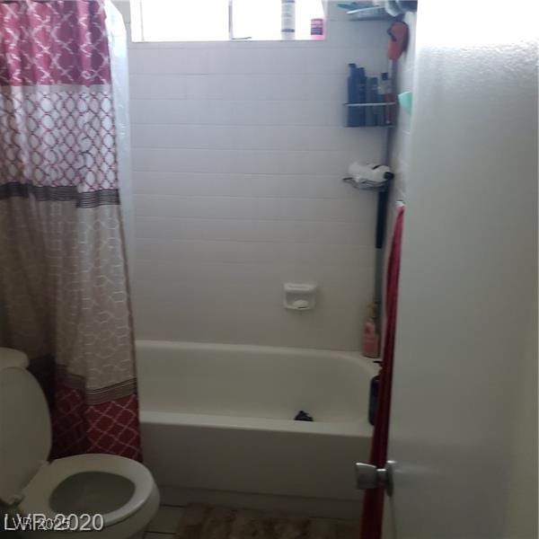 5284 Wellesley Ave, Las Vegas, NV 89122 - full bathroom featuring toilet and shower / bathtub combination with curtain