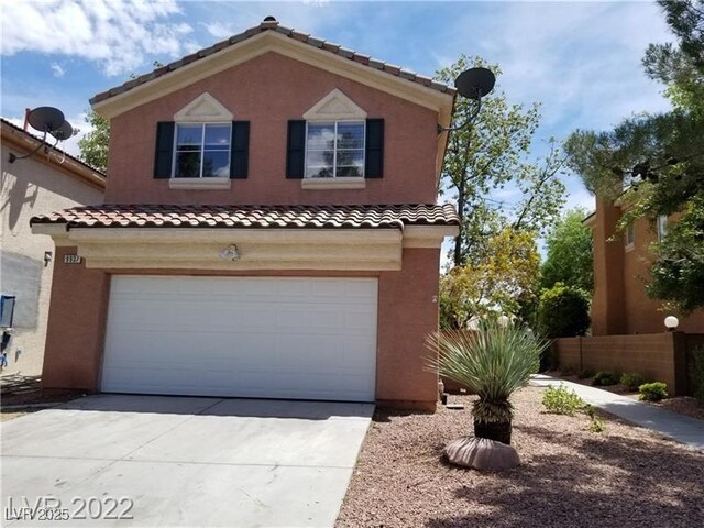 9937 La Paca Ave, Las Vegas, NV 89117 - view of front of home featuring a garage, driveway, stucco siding, and a tiled roof