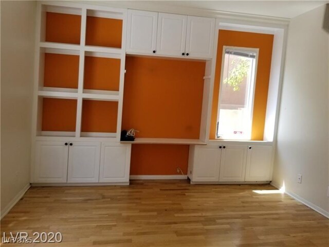 9937 La Paca Ave, Las Vegas, NV 89117 - mudroom featuring light wood-style floors, baseboards, and built in study area