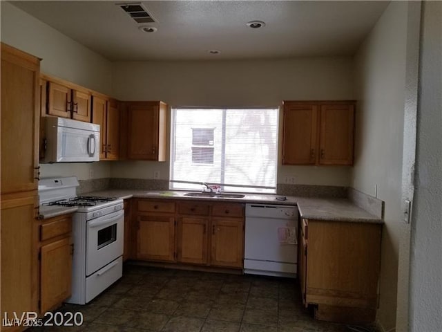9937 La Paca Ave, Las Vegas, NV 89117 - kitchen with white appliances, a sink, and brown cabinetry