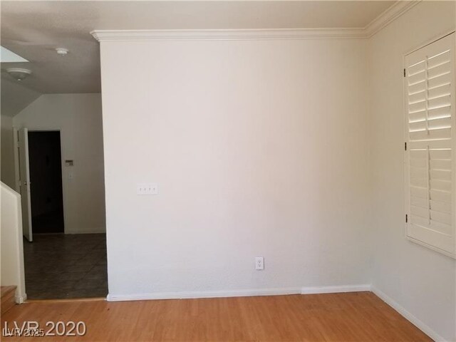 9937 La Paca Ave, Las Vegas, NV 89117 - empty room with wood finished floors, baseboards, and ornamental molding