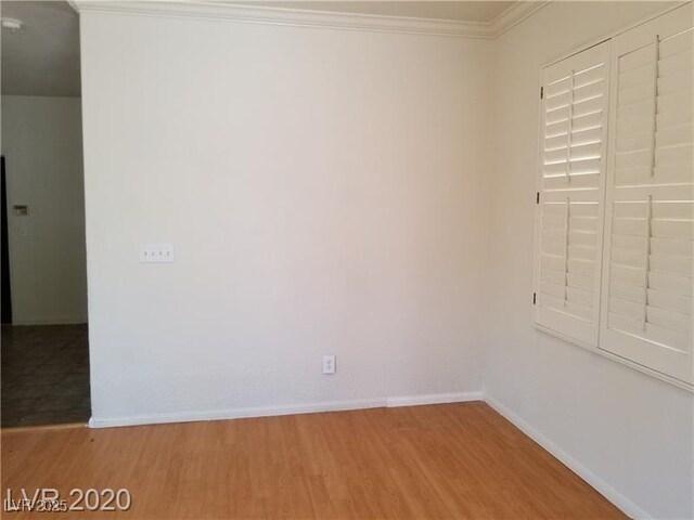 9937 La Paca Ave, Las Vegas, NV 89117 - spare room with light wood-type flooring, ornamental molding, and baseboards