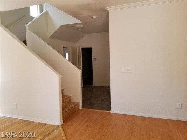 9937 La Paca Ave, Las Vegas, NV 89117 - stairway featuring wood finished floors, baseboards, and vaulted ceiling