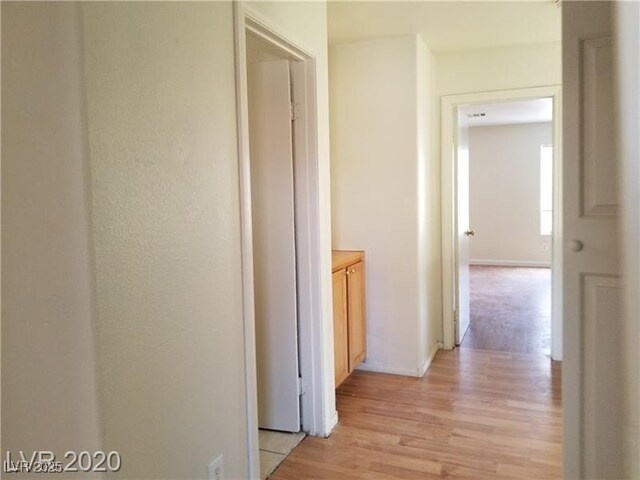 9937 La Paca Ave, Las Vegas, NV 89117 - hallway featuring light wood finished floors and baseboards