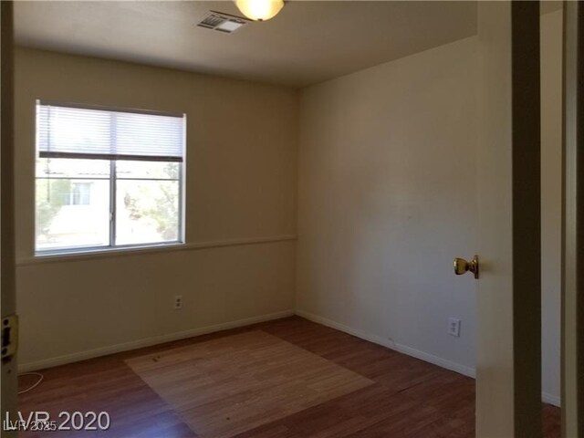 9937 La Paca Ave, Las Vegas, NV 89117 - empty room featuring wood finished floors and baseboards